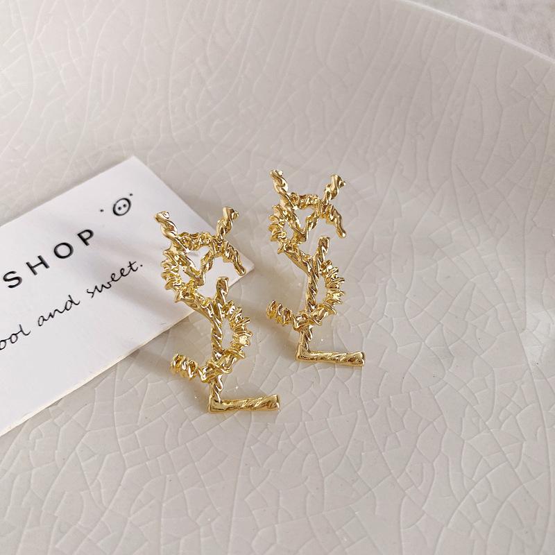 European and American metal wind hollow flower fishtail pearl earrings exaggerated temperament earrings heavy industry earrings