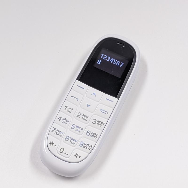 Novo KK1 Super Mini Celular 0.66 polegadas OLED Fone de Ouvido Bluetooth Modificador de Voz Discador Gravação Automática de Chamadas Portátil Barato Desbloqueado Celular