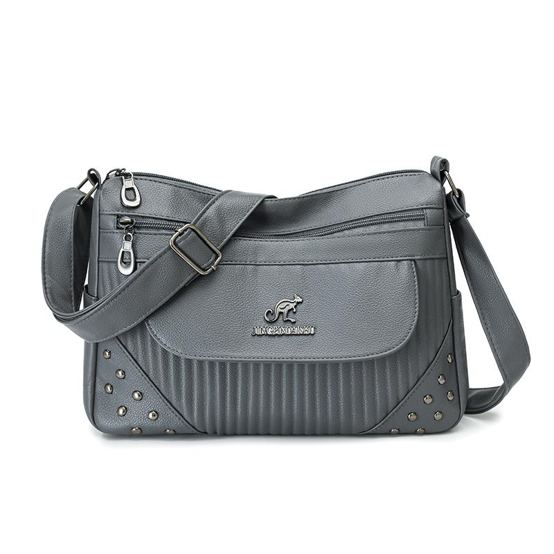 Einfarbige Damen Crossbody-Tasche mit geripptem Panel und Nieten-Details Elegante Kunstleder-Umhängetasche für den täglichen Gebrauch
