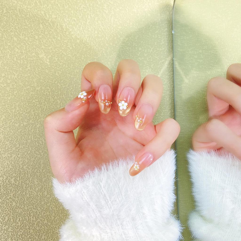 Handmade Nude Pink Cat Eye Manicure with Floral Design - Exquisite Shiny Nail Tips