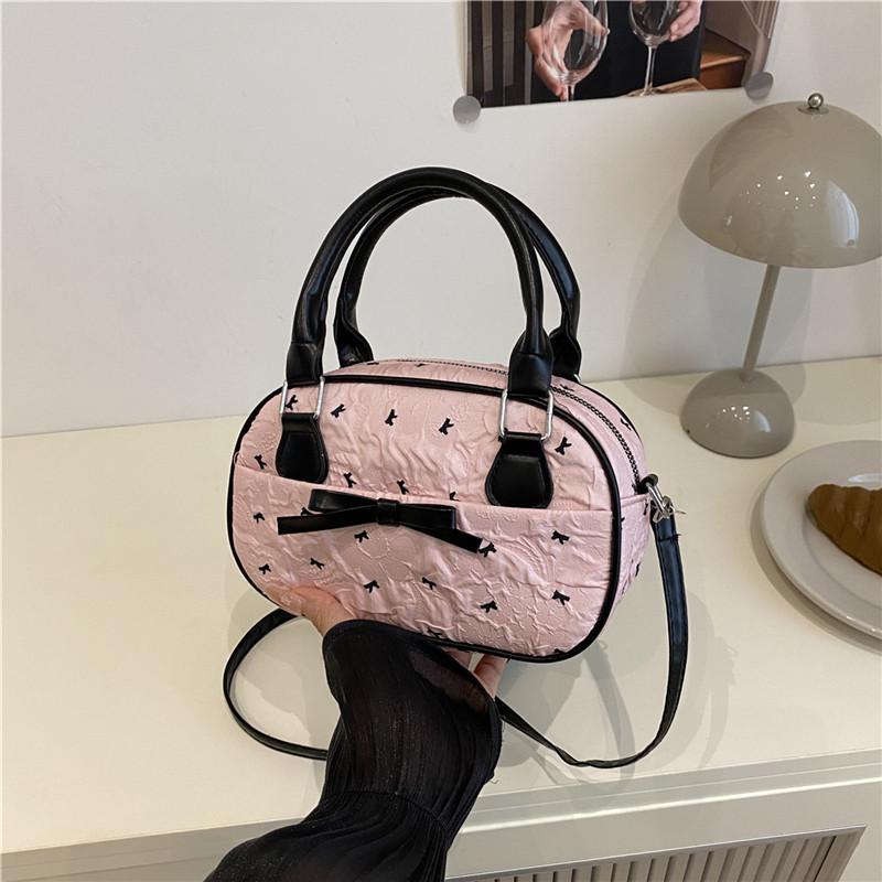 

Korean version of the girl s style Boston bag 2025 summer new high-value handbag casual contrasting color pleated messenger bag розовый