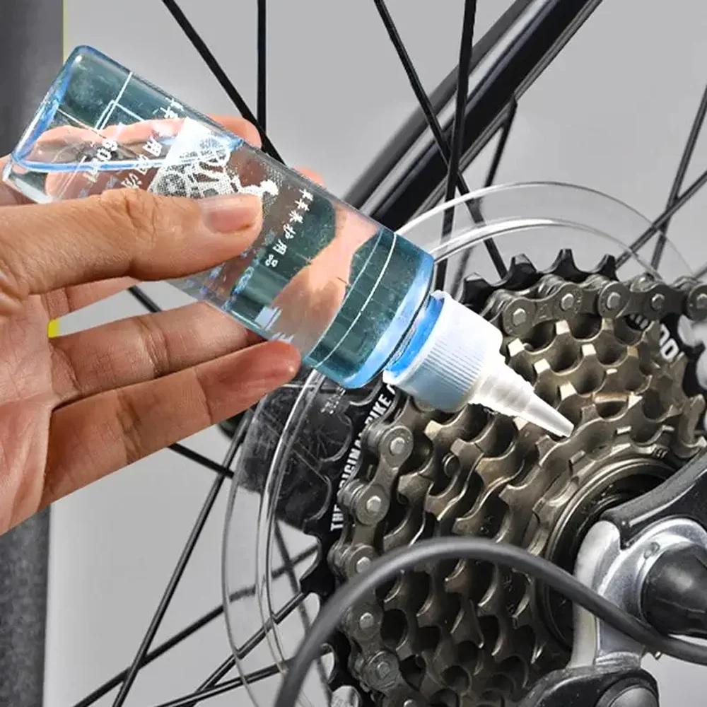 60ML Fahrrad Spezialschmiermittel Langlebiges Ketten-Trockenschmiermittel Kettenöl Fahrradkettenöl Wachsartiges Wartungsöl Squirt MTB Rennrad