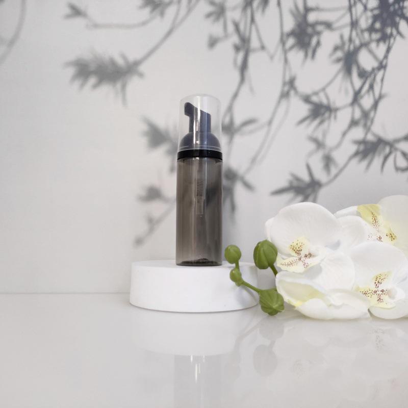 Available 60ml Transparent Black Foam Mousse Bottle for Face Wash and Travel-friendly Cosmetic Packaging.