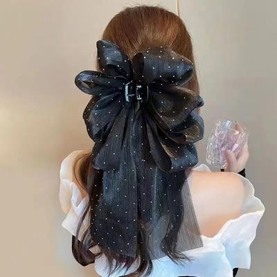 A Large Bow Headpiece With An Extremely Charm, A Spring Clip At The Back Of The Head, And A Long Ribbon Hair Clip.