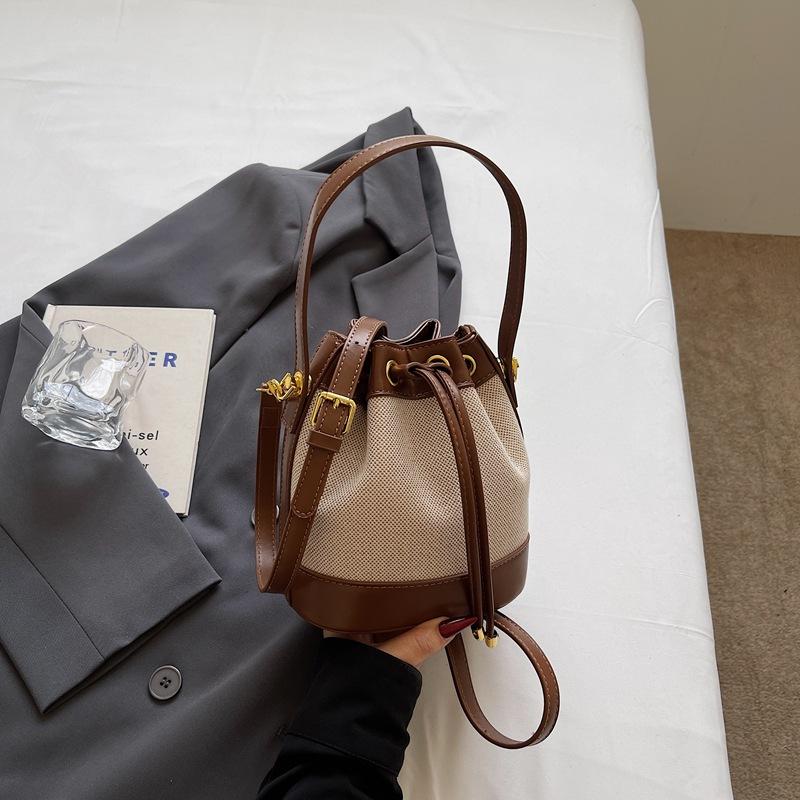 Fashion women's bags new niche high-value contrasting color shoulder messenger bag retro texture portable small bucket bag