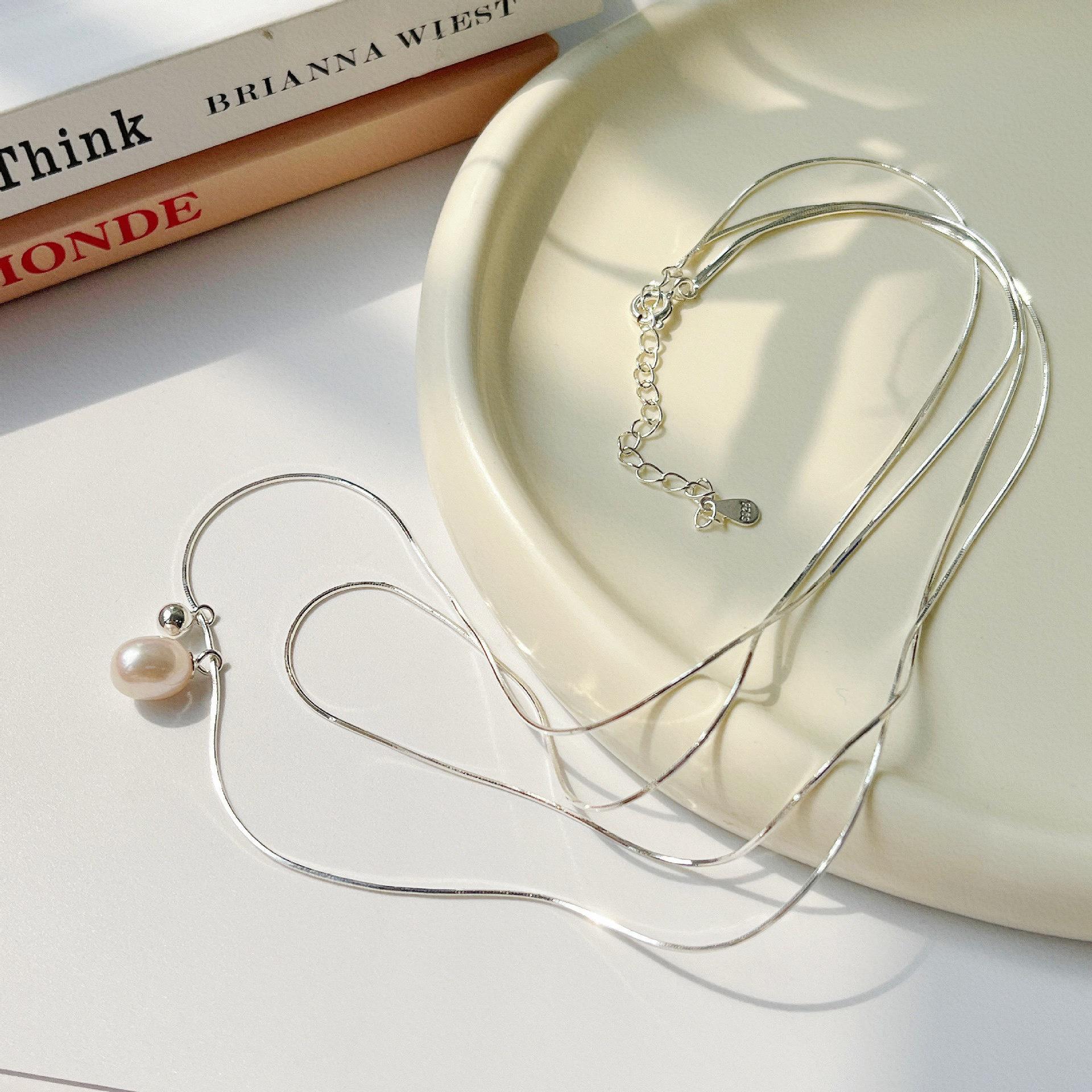 Korean Style Double Layer Pearl Necklace for Women - Simple, High-End, Cold Aesthetic with Snake Bone Chain.