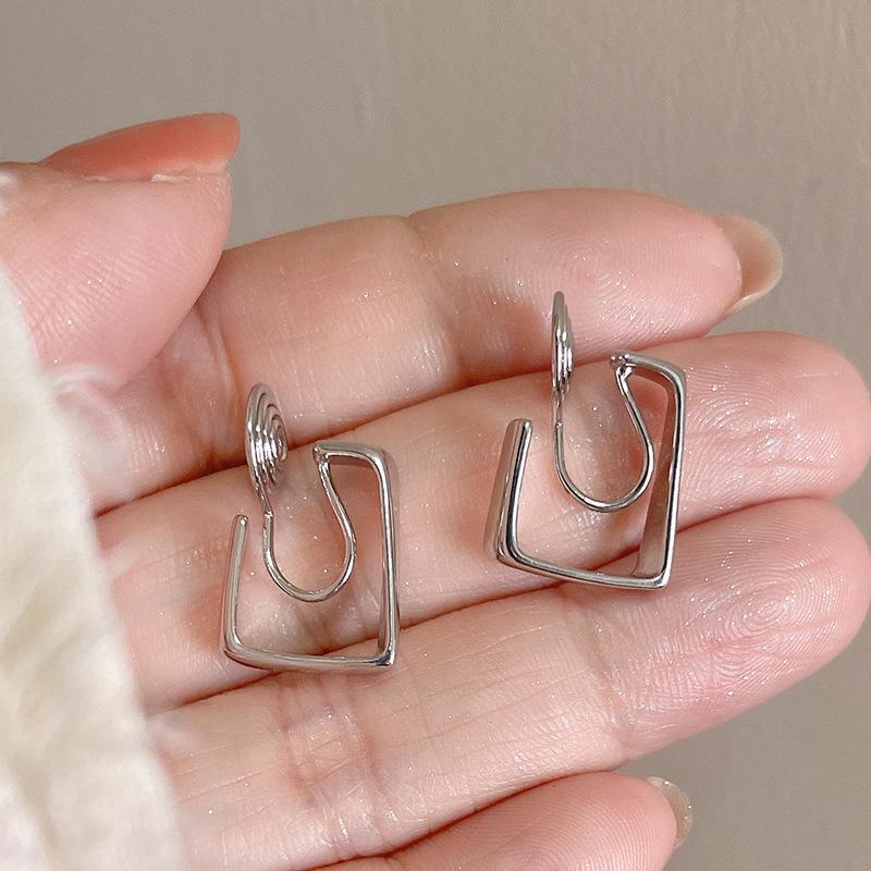 Square Mosquito Coil Ear Clips: Fashionable, Pain-Free Metal Earrings with a Unique, Versatile Design for Women.