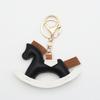 Cartoon Rocking Horse Keychain: Creative PU Leather Pony Charm with Cotton Filling.