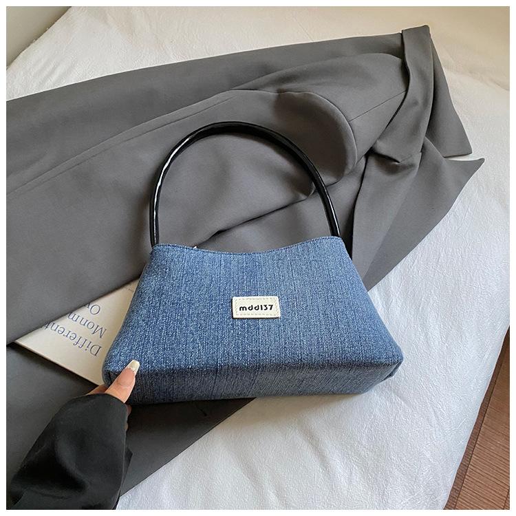 Korean version of denim hand-carried dumpling bag women 2025 new retro niche foreign style casual single shoulder underarm commuter bag