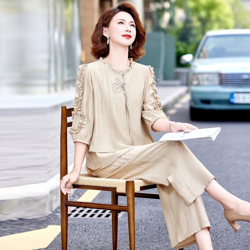 Elegante Set Estivo 2026 in Due Pezzi: Pantaloni larghi alla moda che contrastano l'età per donne di mezza età ed anziane