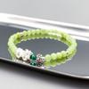 Silver Vihu Peridot Crystal Bracelet with Witch's Workshop Crystal In Its Bite