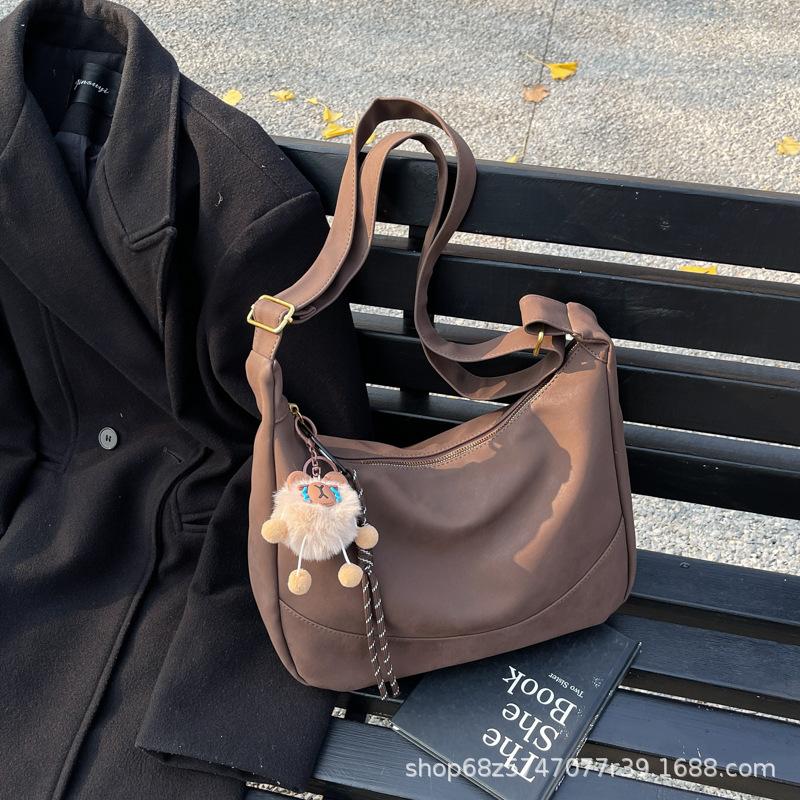 

Autumn and winter new trendy casual dumpling bag women s 2025 Korean version retro versatile shoulder bag large-capacity tote bag темно-коричневого кольору
