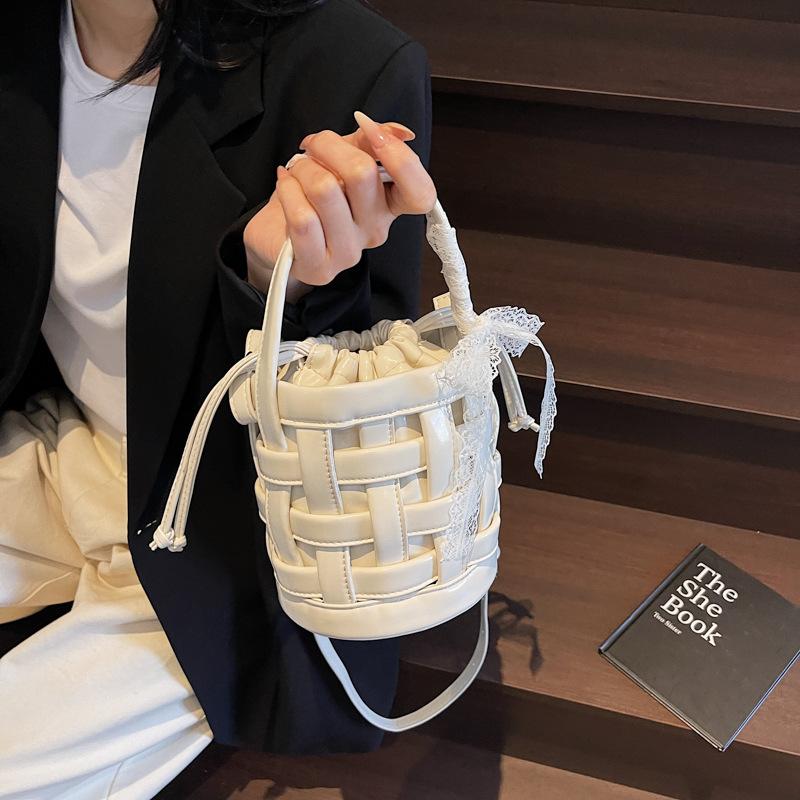 This year's popular bag 2025 new Korean version fashion hollow woven bag women's portable crossbody drawstring bucket bag