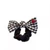 Age-Reducing Black & White Plaid Bow Hair Tie