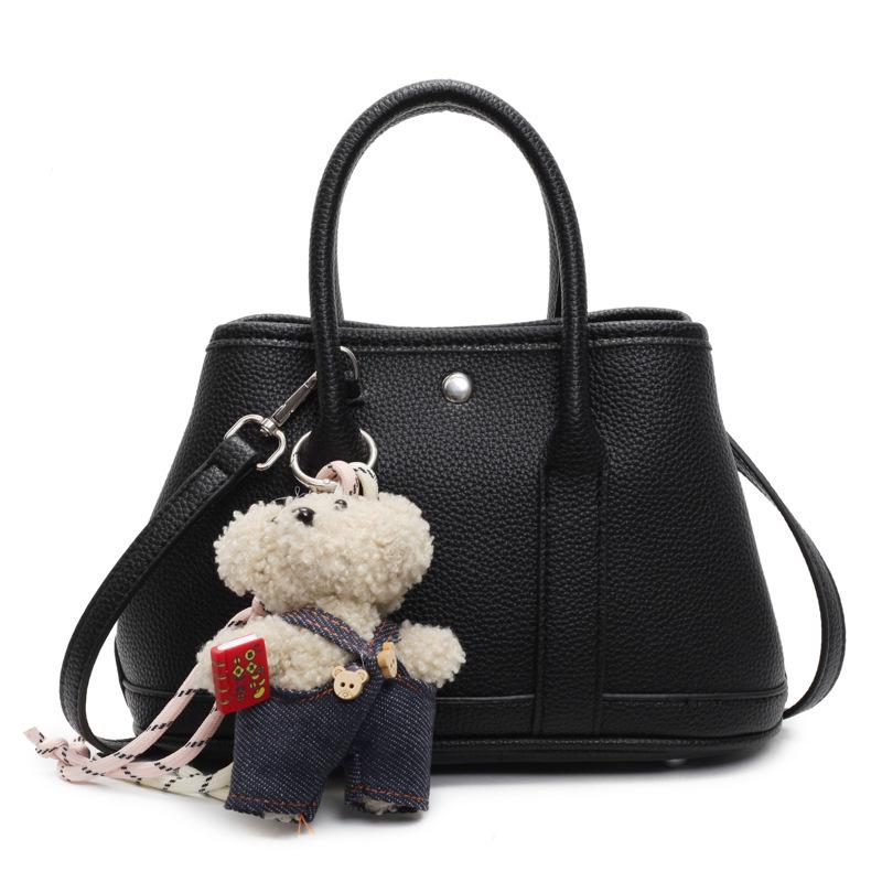2025 New Niche Simple Leisure Commuter Portable Bucket Bag Versatile Solid Color Child and Mother Bag Messenger Bag Bag