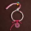 Handmade Tibetan Ghost Flower Coin Bracelet: Adjustable Five-Color Braided Rope with Tassel In Ethnic Style