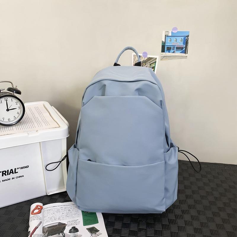 Sac d'école nouveau sac d'école style collège couleur unie grande capacité sac à dos étudiante simple sac à dos femme