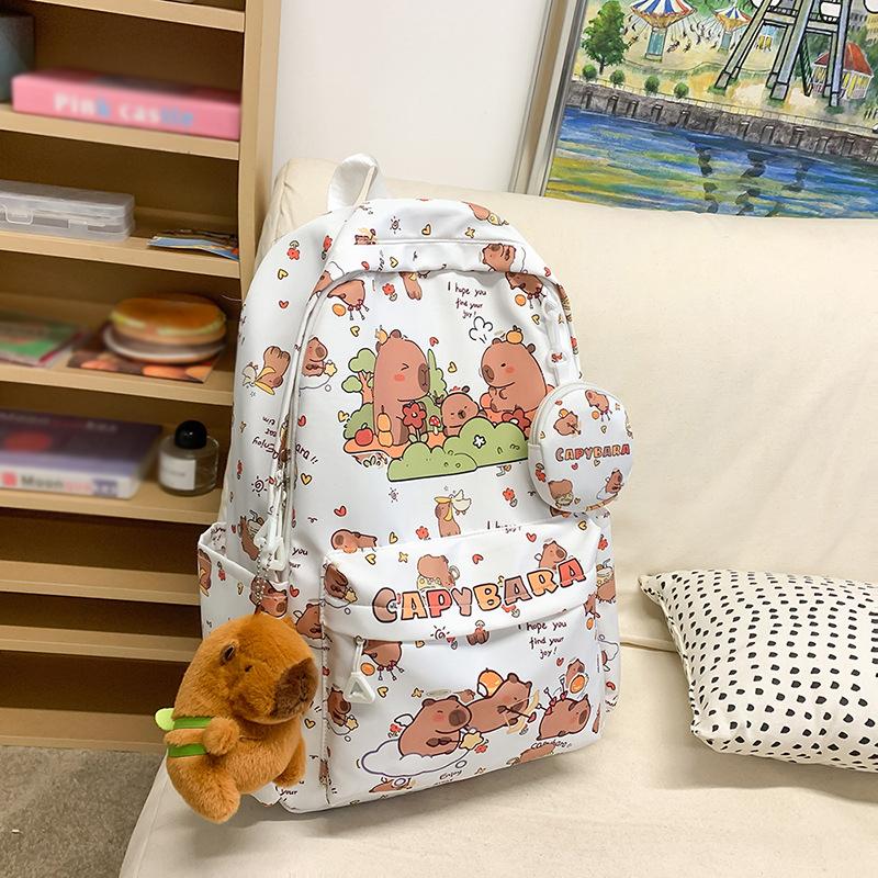 

2025 Новый Рюкзак Студенческий с Принтом Большая Вместимость Легкий Рюкзак с Защитой Спины Милый Мультяшный Повседневный Джокер Школьный Рюкзак белый