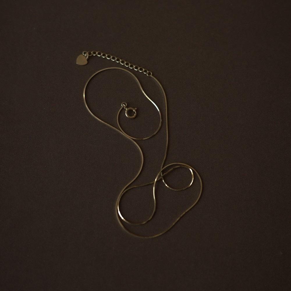 Elegant European & American Minimalist 925 Sterling Silver 18K Gold-Plated Snake Bone Chain for Women – Fine Cold-Style Clavicle Necklace.