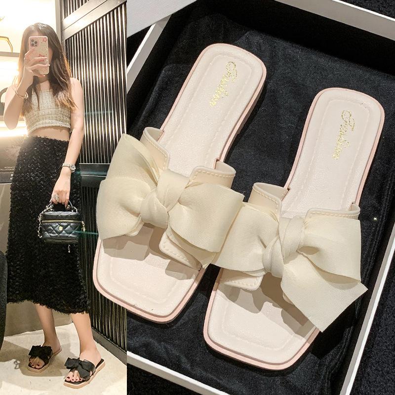 Bow slippers women's summer wear new fashion home flat bottom non-slip fairy wind one-word sandals soft bottom