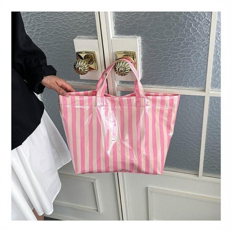 This Water-Resistant Pvc Tote Bag Features A Pink And Blue Striped Design, A Large Capacity, And Is Suitable For Beach Shopping,