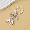 Elegant Silver Ice Skating And Snowflake Pendant Keychain For Winter Sports Enthusiasts Stainless Steel Key Holder