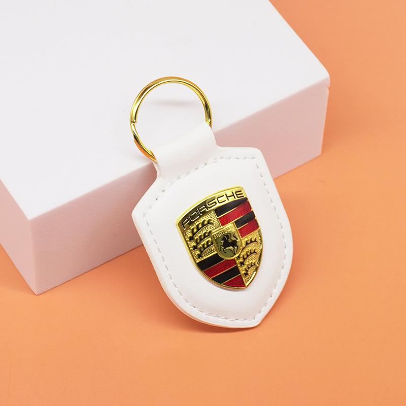 

Кожаный брелок для ключей автомобиля Щит Тип 3D Эмблема Кольцо для ключей Для Porsche Panamera Cayenne Taycan 911 718 Macan Carrera-GT 928 944 968 944 белый