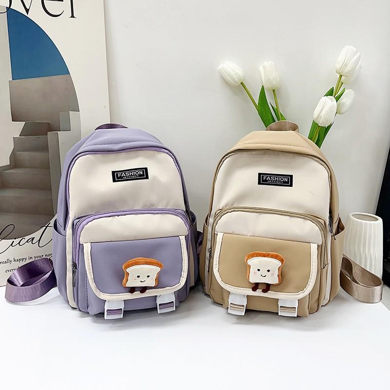 New primary school students backpack women's new large-capacity first and second grade schoolbag simple and fashionable contrasting color backpack