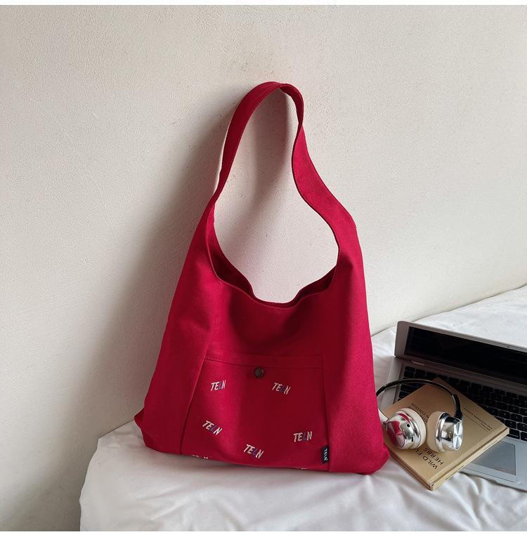 Canvas bag Women's shoulder bag Large capacity commuter tote bag Versatile student armpit bag