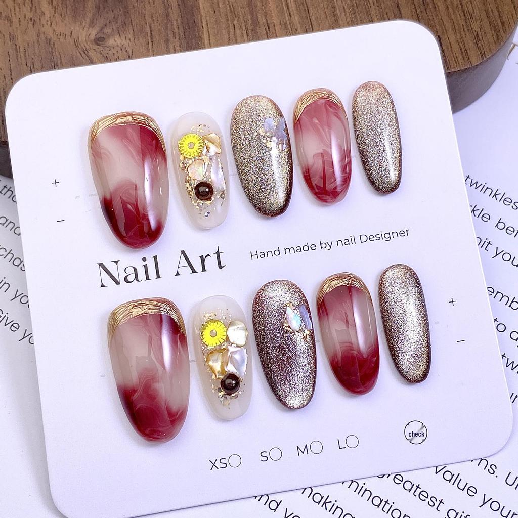 New Year Cat Eye Nails: Wine Red Gradient with Gold Foil, 3D Rhinestones, and Magic Mirror Powder