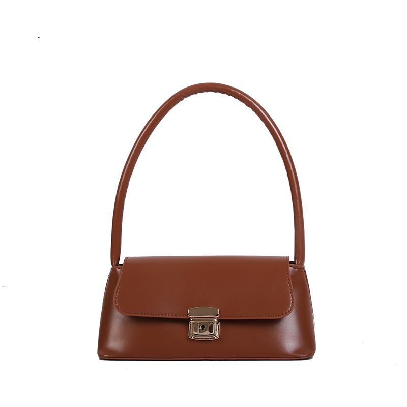 

New autumn and winter Hong Kong style retro baguette bag women s bag 2025 new Korean version versatile texture foreign style shoulder handbag светло-коричневого