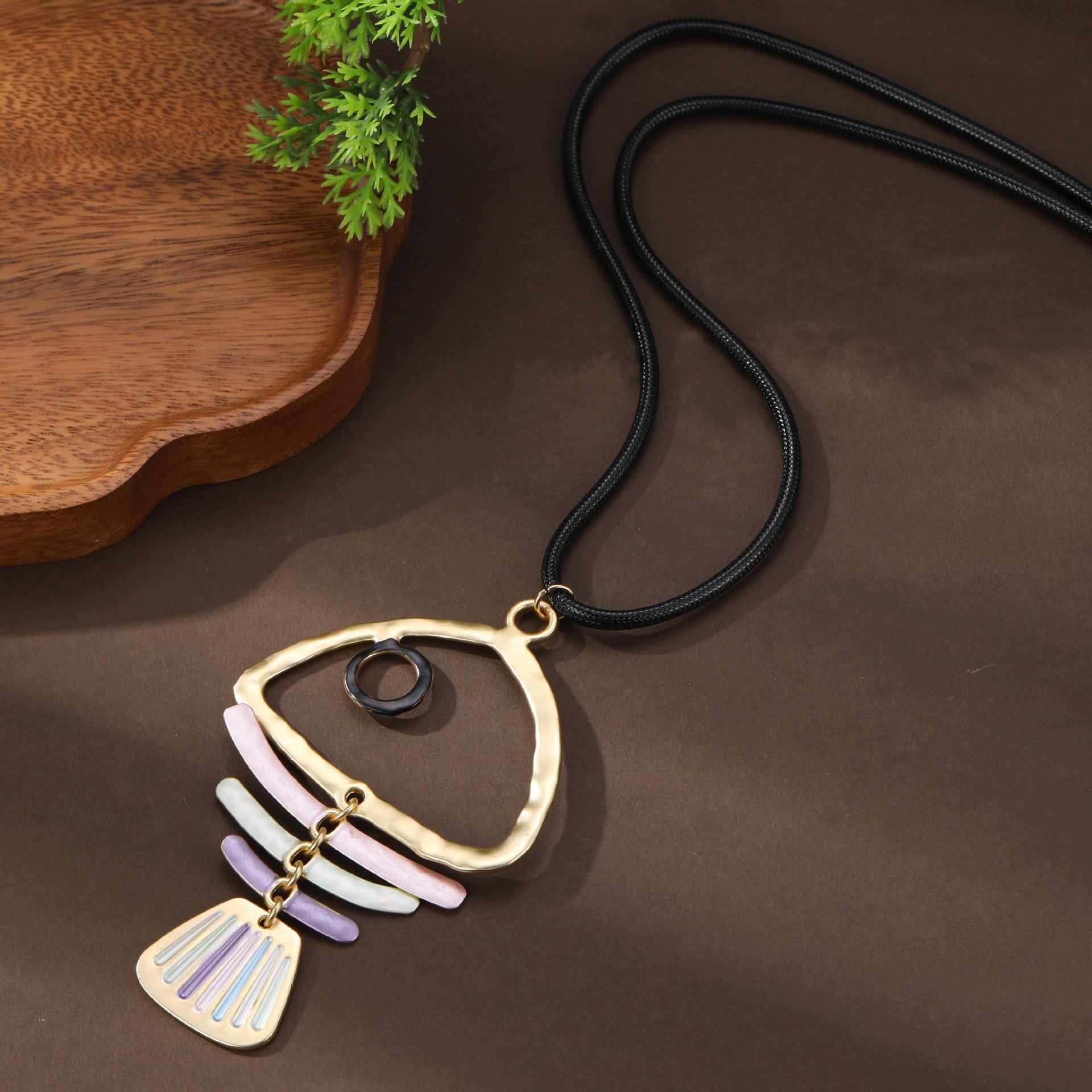 

Новая эмалевая цветная полая рыбья кость кожаная веревка длинная подвеска женская мода рыбья кость универсальное длинное ожерелье