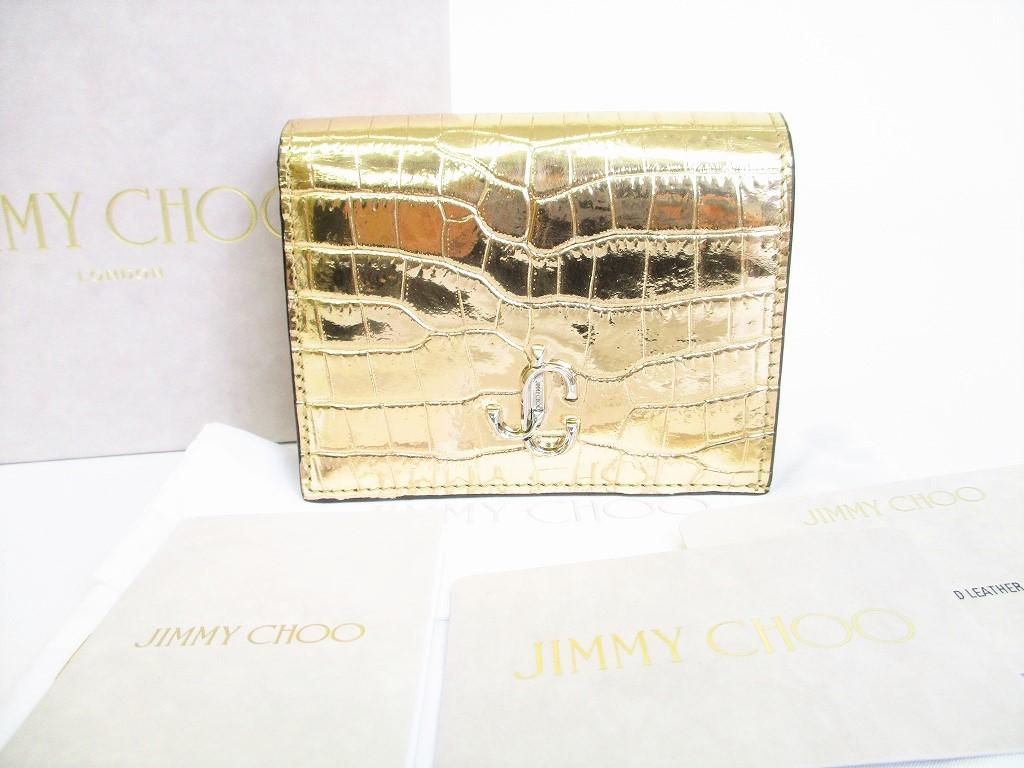 

Автентичний шкіряний гаманець Jimmy Choo зі світлим золотом, компактний гаманець №8384, відремонтований