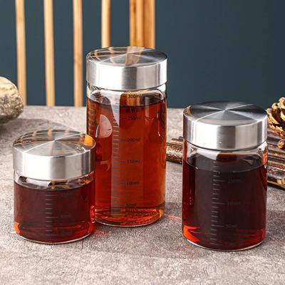 100-500ml Flüssigkeitsaufbewahrungsbecher Hochborosilikat Hitzebeständigkeit Tragbar Dichtversiegelte Glasflasche mit Kapazitätsskala Glasvorratsglas