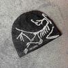Czapka zimowa Arc'teryx Bird Head Toque Czarna Wełna Merino Dzianinowa Czapka Zimowa Unisex Czarny stya