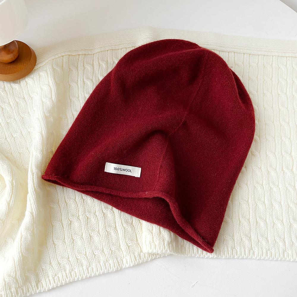 Solid color wool knitted stacking hat women's autumn and winter 0% all-wool knitted hat fashionable versatile cold hat ear protection hat