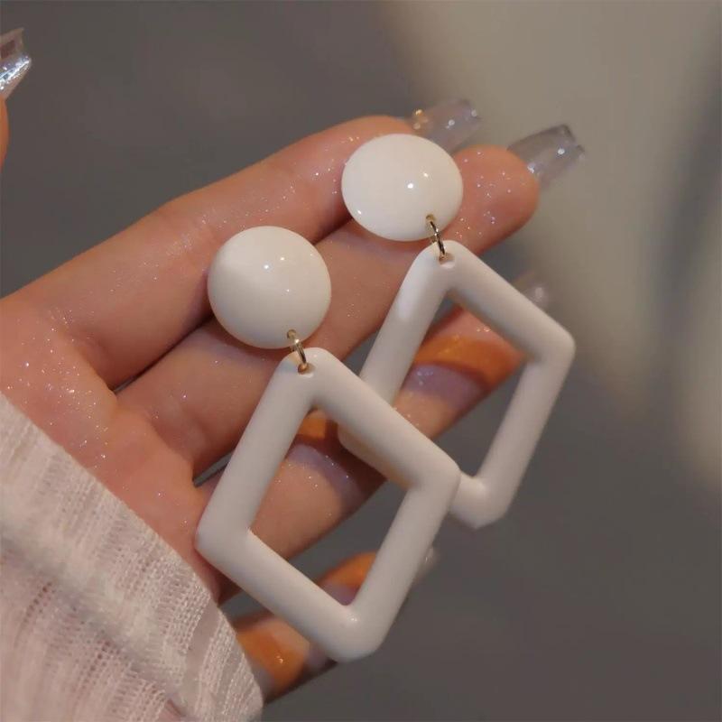 

French personalized milky white retro earrings simple hollow rhombus geometric stud earrings women s fashion versatile ear jewelry earrings