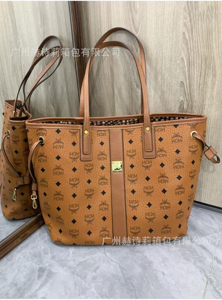 Neue MC-bedruckte Mutter-Kind-tragbare Tote-Schultertasche große Kapazität Messenger-Tasche Mode vielseitig Unterarm-Pendler-Damentasche