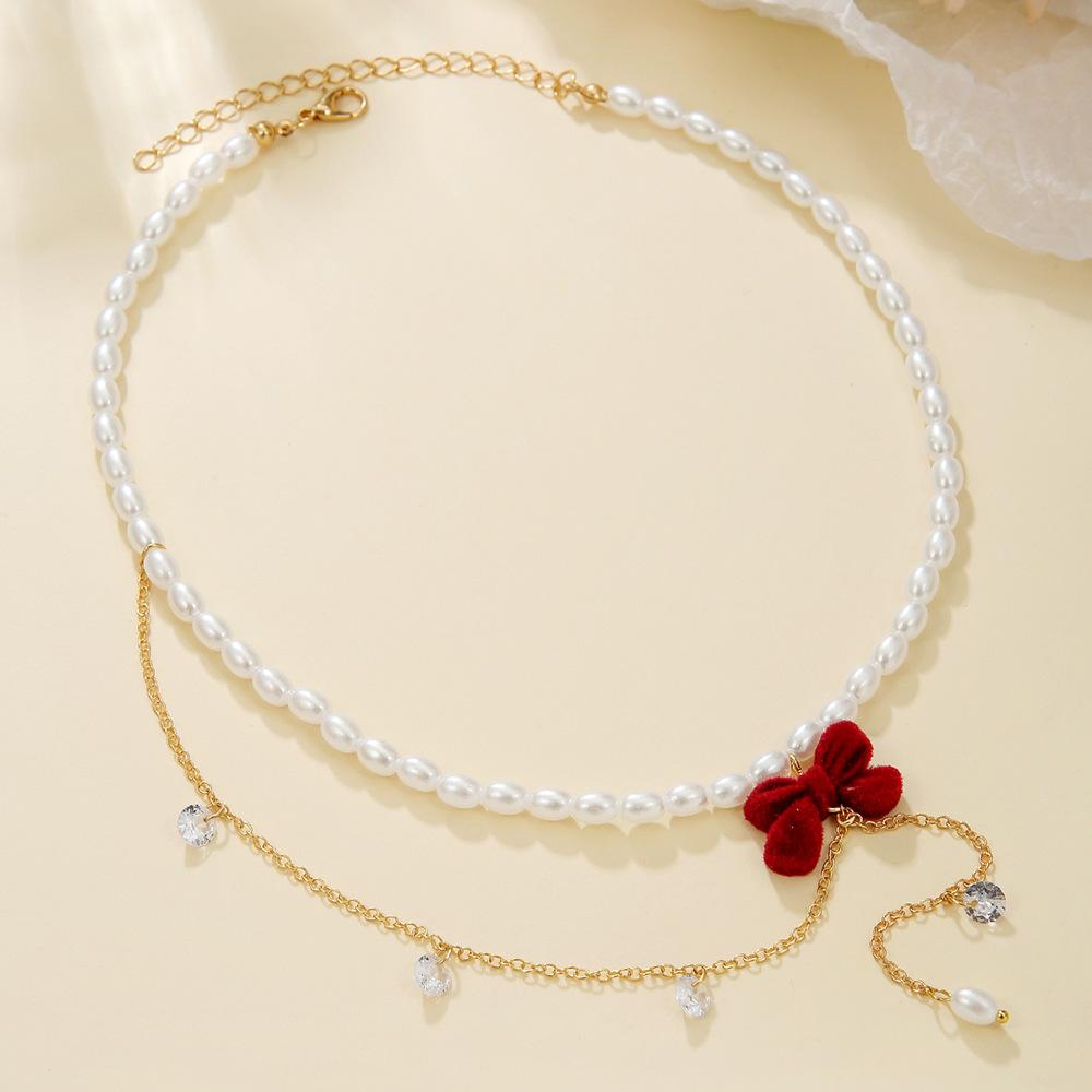 Japan and Korea fashion flower imitation pearl necklace, retro rhinestone bow temperament collarbone chain women's jewelry