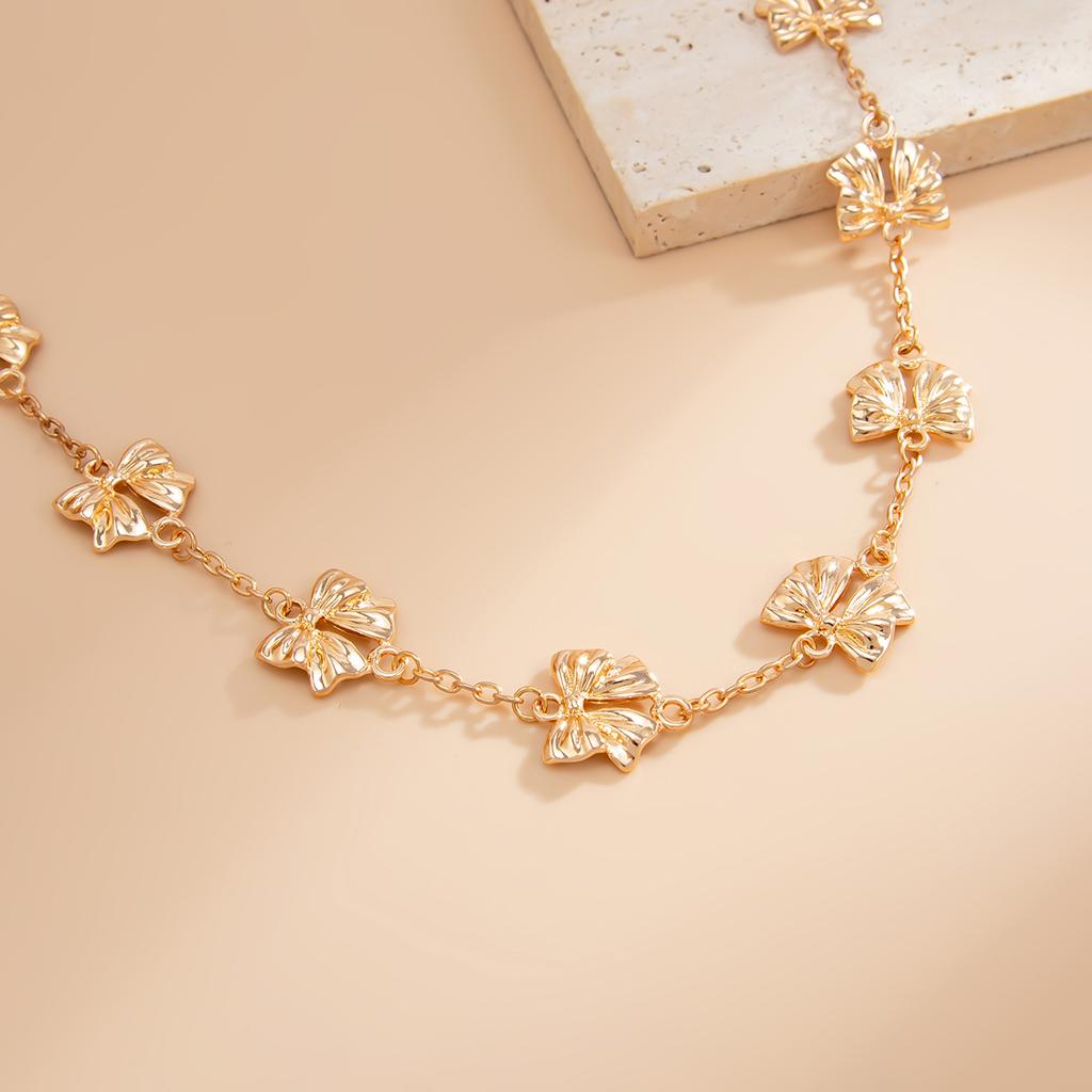 Temperament Fashion Bow Cross Necklace Simple Imitation Pearl Tassel Long Section Collarbone Chain
