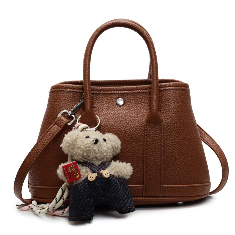 2025 New Niche Simple Leisure Commuter Portable Bucket Bag Versatile Solid Color Child and Mother Bag Messenger Bag Bag