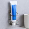 Stainless steel toothpaste holder (silver) with attached toothpaste holder