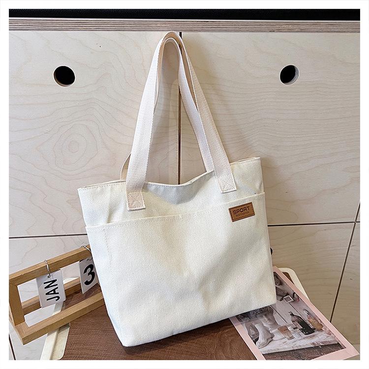 

Women s Versatile Canvas Tote: Simple, Large Capacity, Single Shoulder or Handheld Bag for Students & Commuting