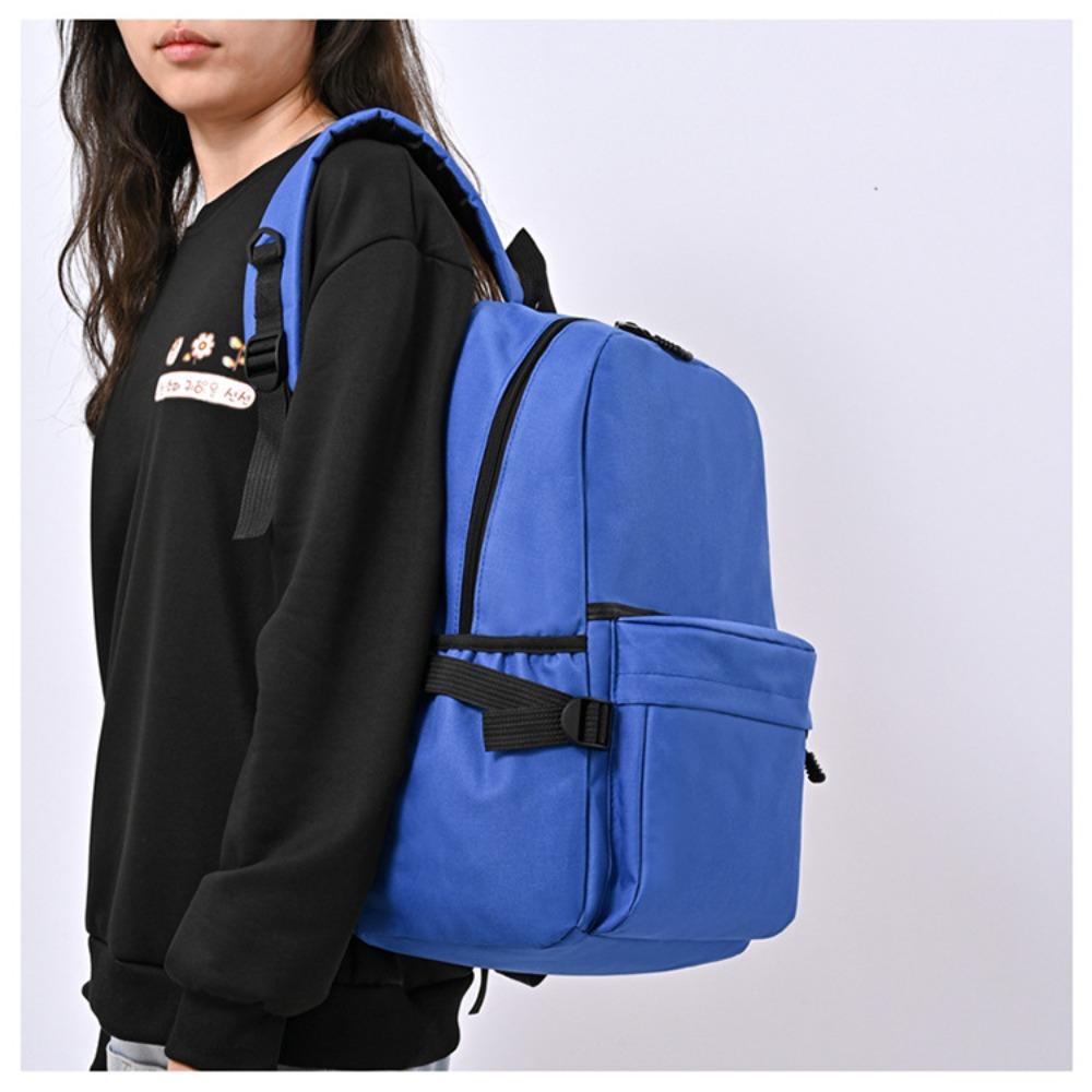 Travel agency backpack solid color fabric backpack primary and secondary school student schoolbag travel bag
