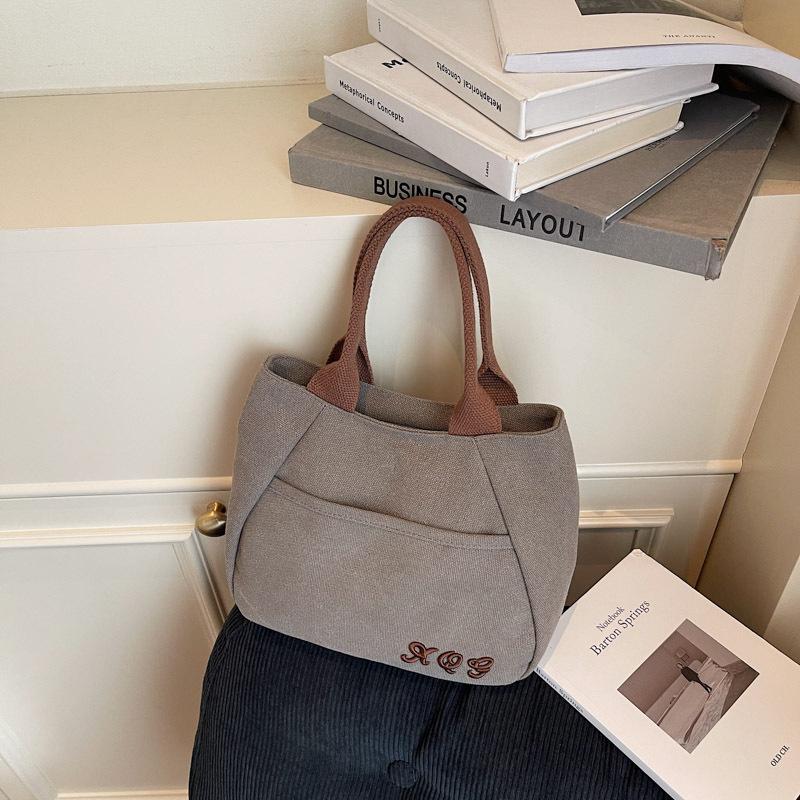 

Textured casual canvas large-capacity handbag bag, new retro solid color embroidered letter bucket bag темно-серого