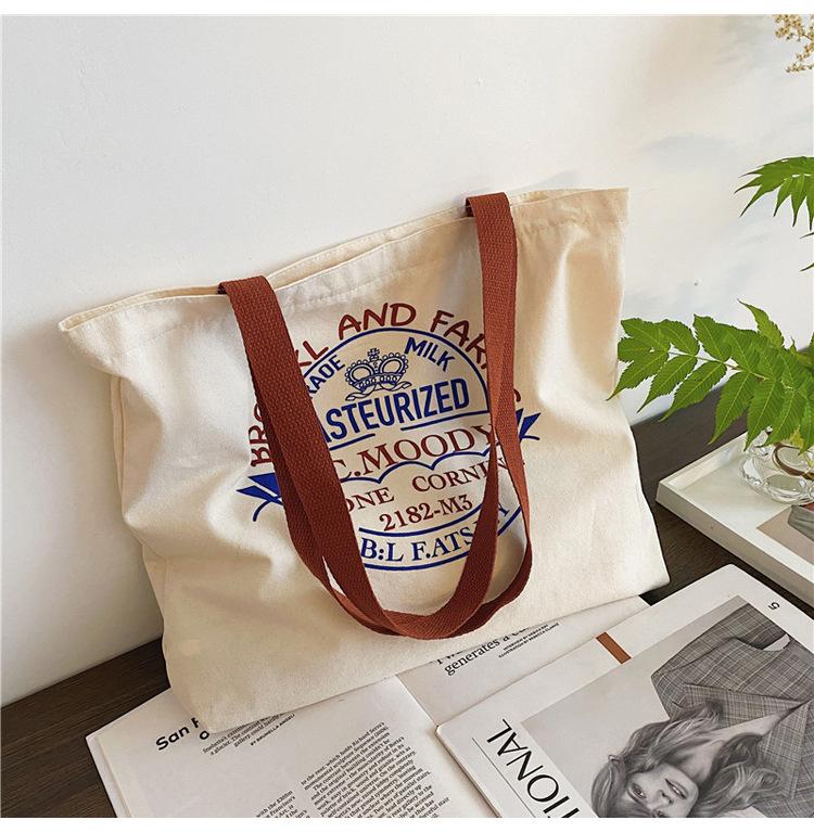 Canvasväska dam campus student axelväska ins vind stor kapacitet bokstav tygkasse