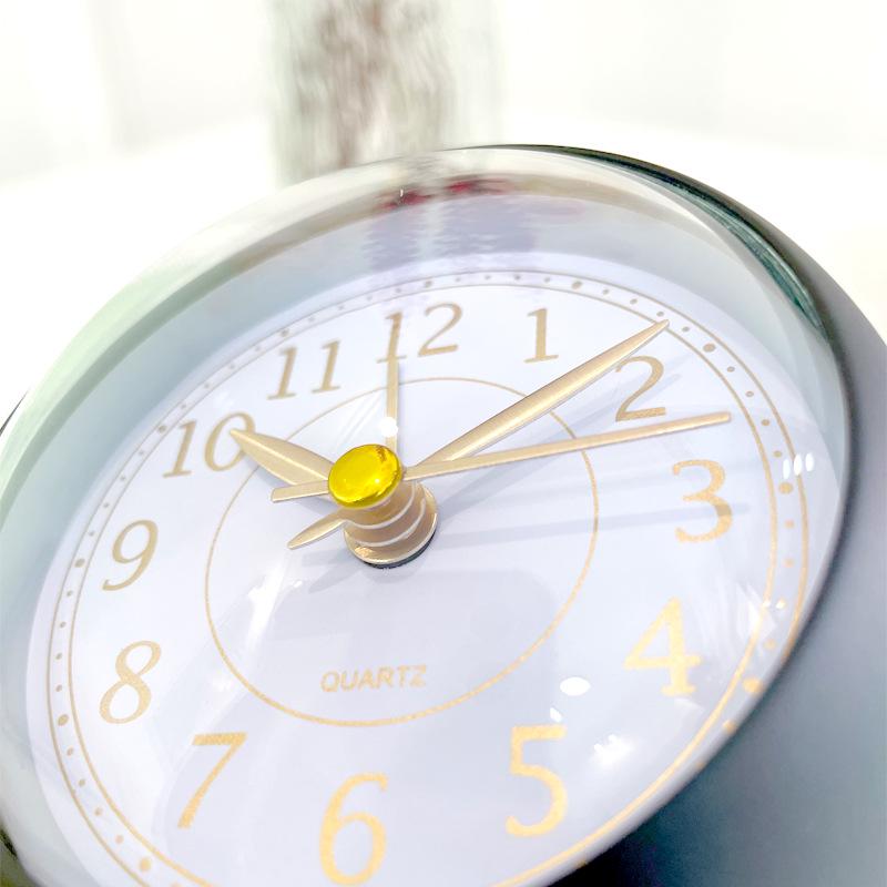 Silent Metal Alarm Clock with Night Light and Gold Stamped Spherical Face - Perfect for Students and Children.