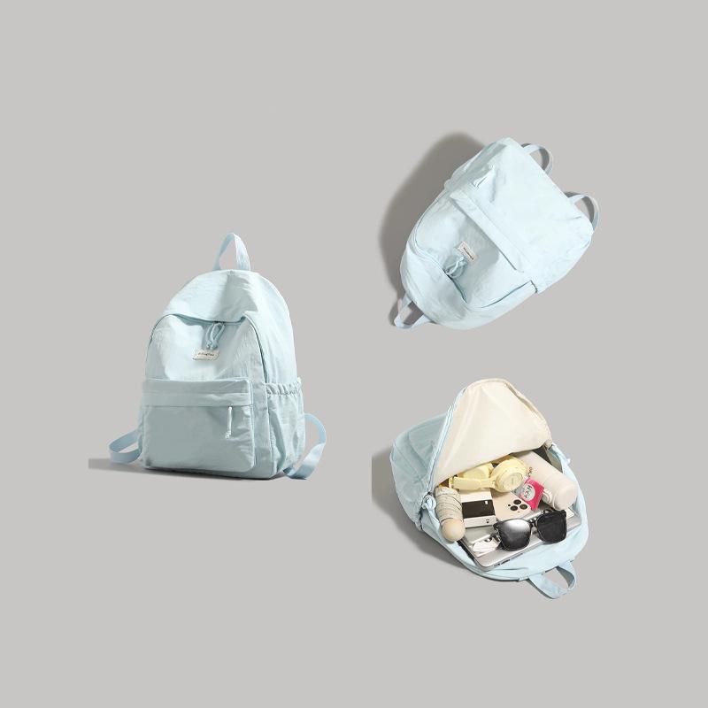 High-value solid-color backpack women's 2025 new college student schoolbag large-capacity lightweight short-distance travel backpack