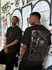 This Men's Black Street-Style Cartoon Anime T-Shirt, Featuring A Berserker Theme, Blends Retro And