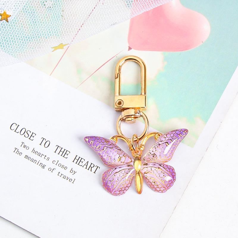 Gradient Butterfly Pendant: Iridescent Keychain Charm for Backpack or Earphone Case.